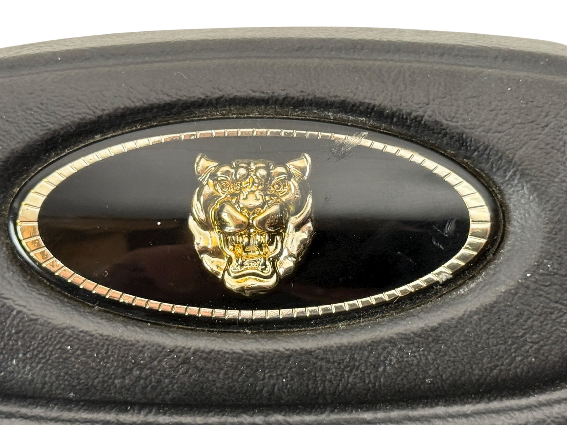 OEM Jaguar XJ6 Series III steering wheel with horn pad. Genuine 1980–87 UK-made replacement part in good driver condition. Vintage Jaguar interior collectible.