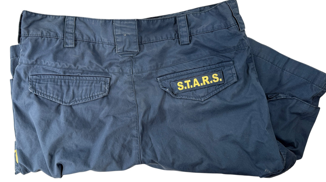Authentic Resident Evil S.T.A.R.S. cargo shorts with official Capcom tags. Rare mid-2000s game merch in great condition. Ideal for collectors and fans.