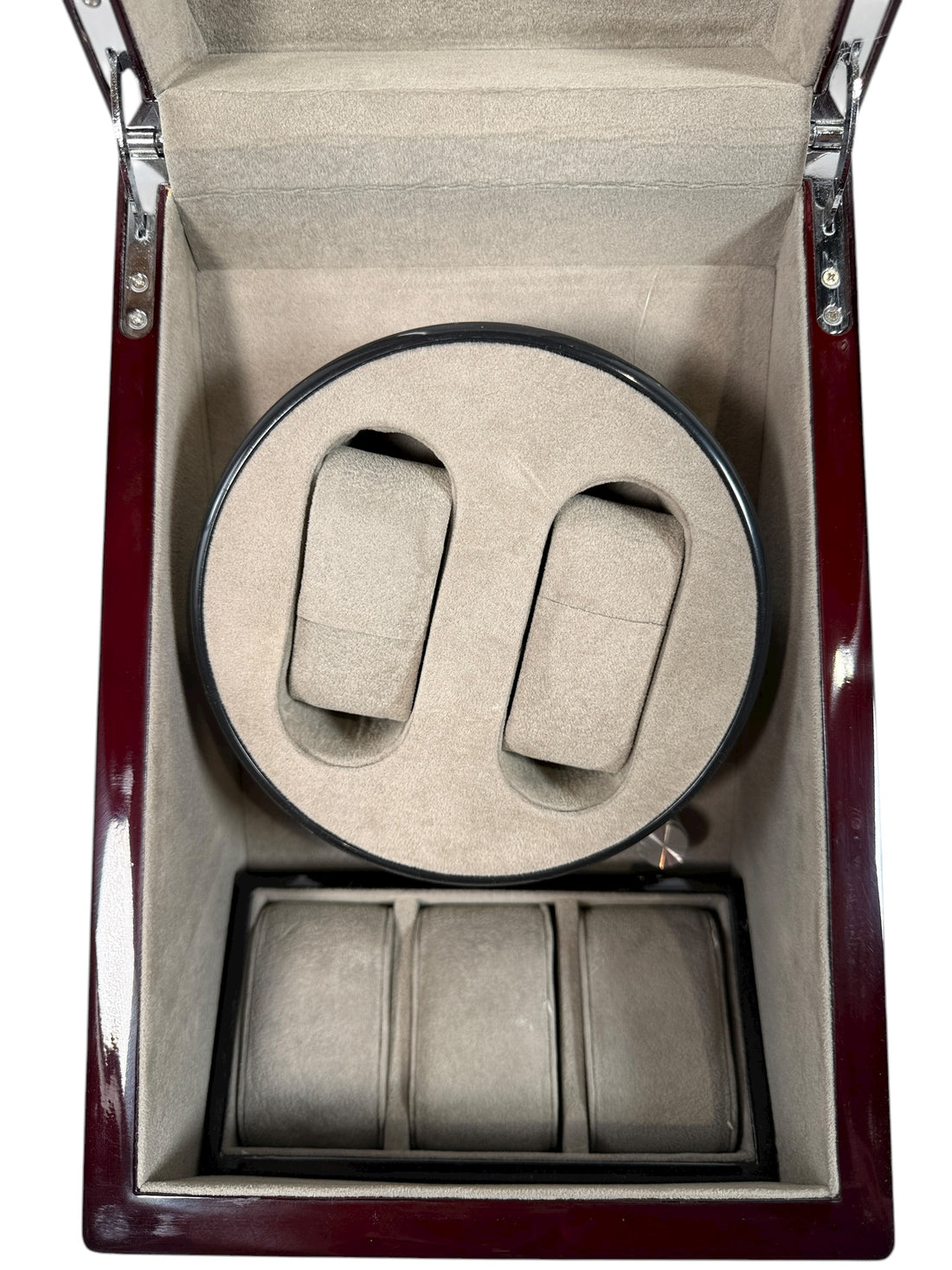 Working dual automatic watch winder in piano black lacquer with storage, display lid, and AC adaptor. Clean, functional, and perfect for protecting your watches.