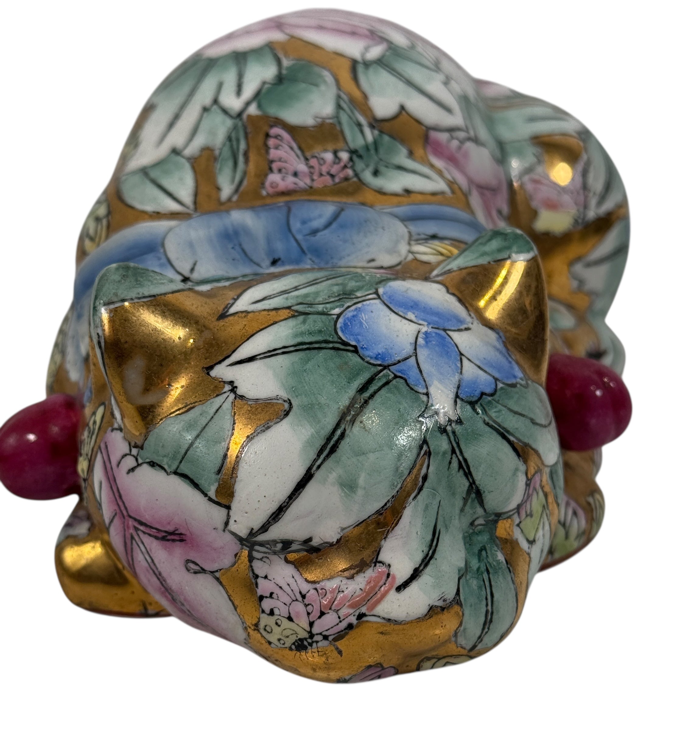 Large 10” Famille Rose porcelain reclining cat with floral enamels and gilt details. Mid-century Chinese export decor piece. Beautiful display sculpture.