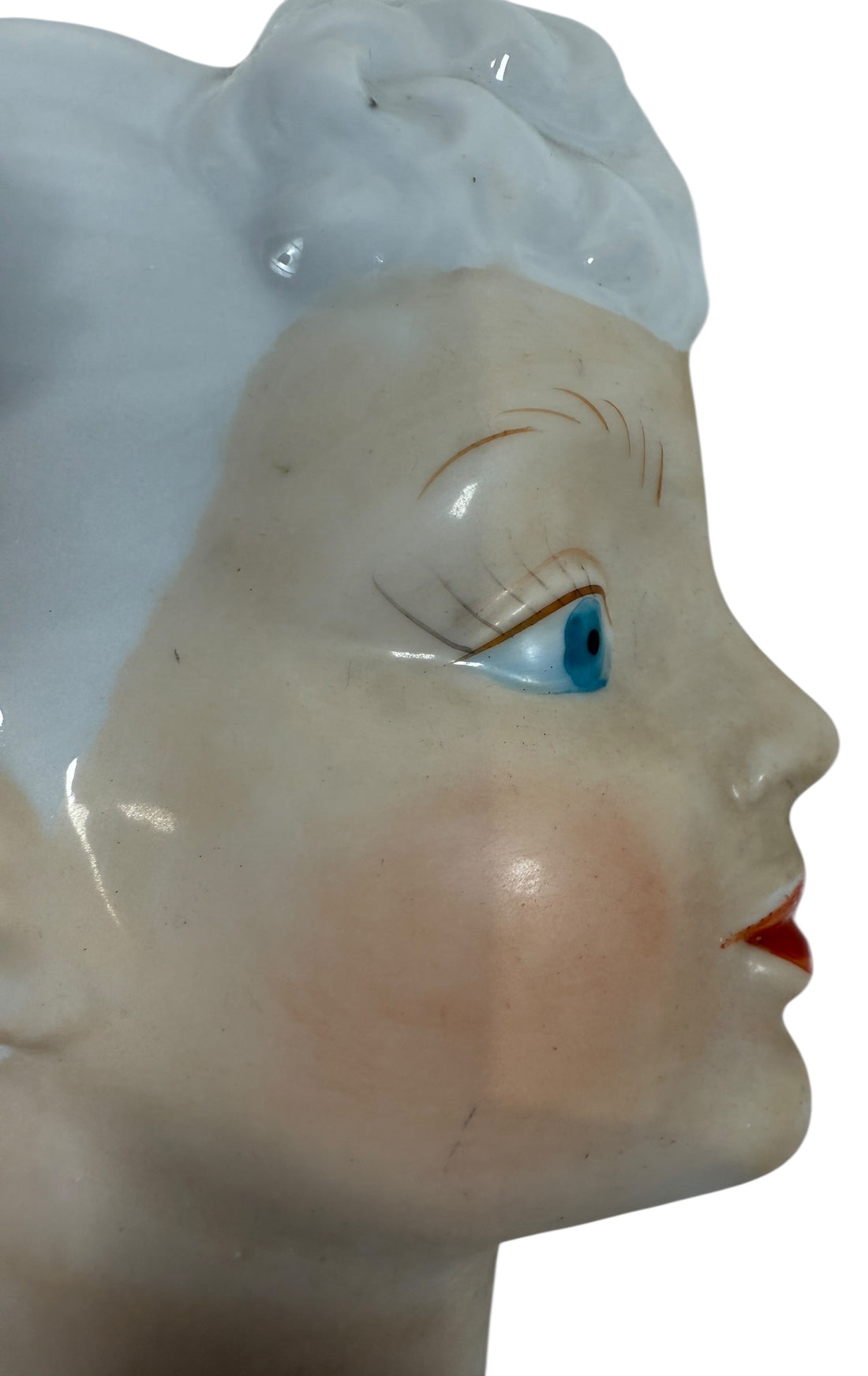 Mid-century Japanese porcelain lady-head wall mask with floral accents. Vintage décor piece with one chipped flower. Ideal for collectors and retro interiors.