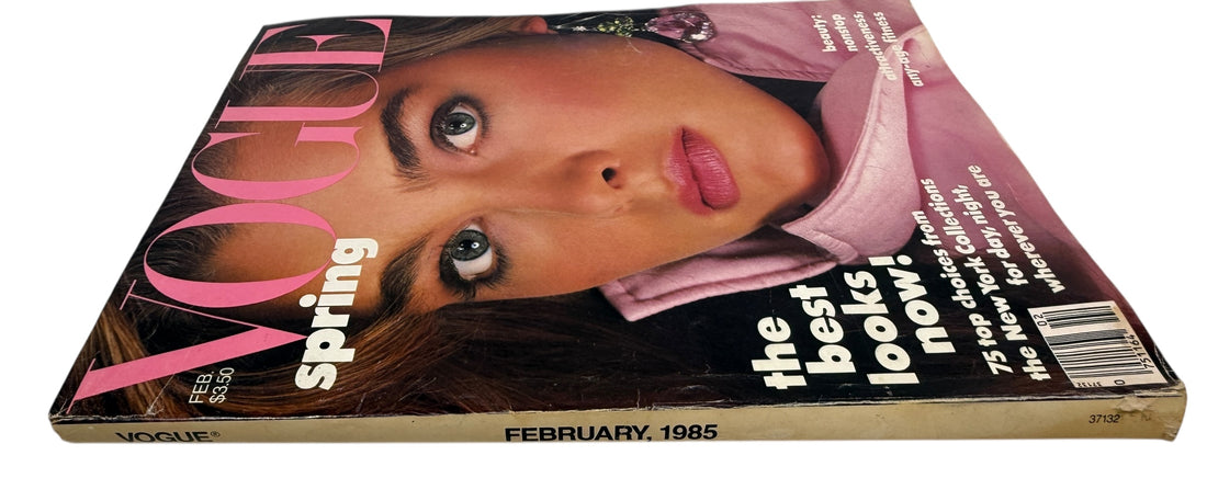 Vintage Vogue US February 1985 featuring Brooke Shields. Classic 80s spring fashion and beauty editorials. Original issue with visible spine wear.
