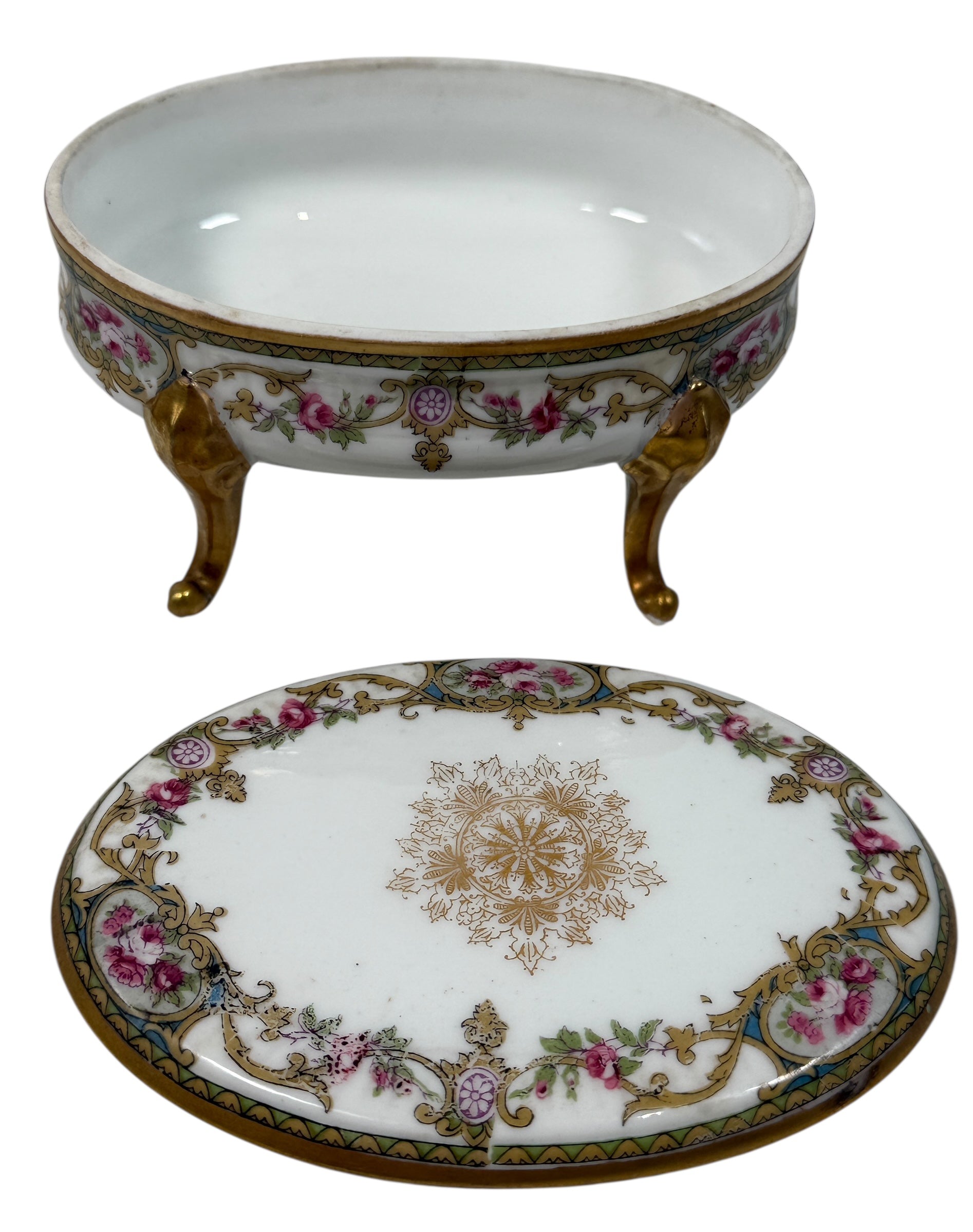 Antique French-style porcelain trinket box with gilt bronze legs, c.1900. Elegant vanity décor with floral details and classic Belle Époque charm.