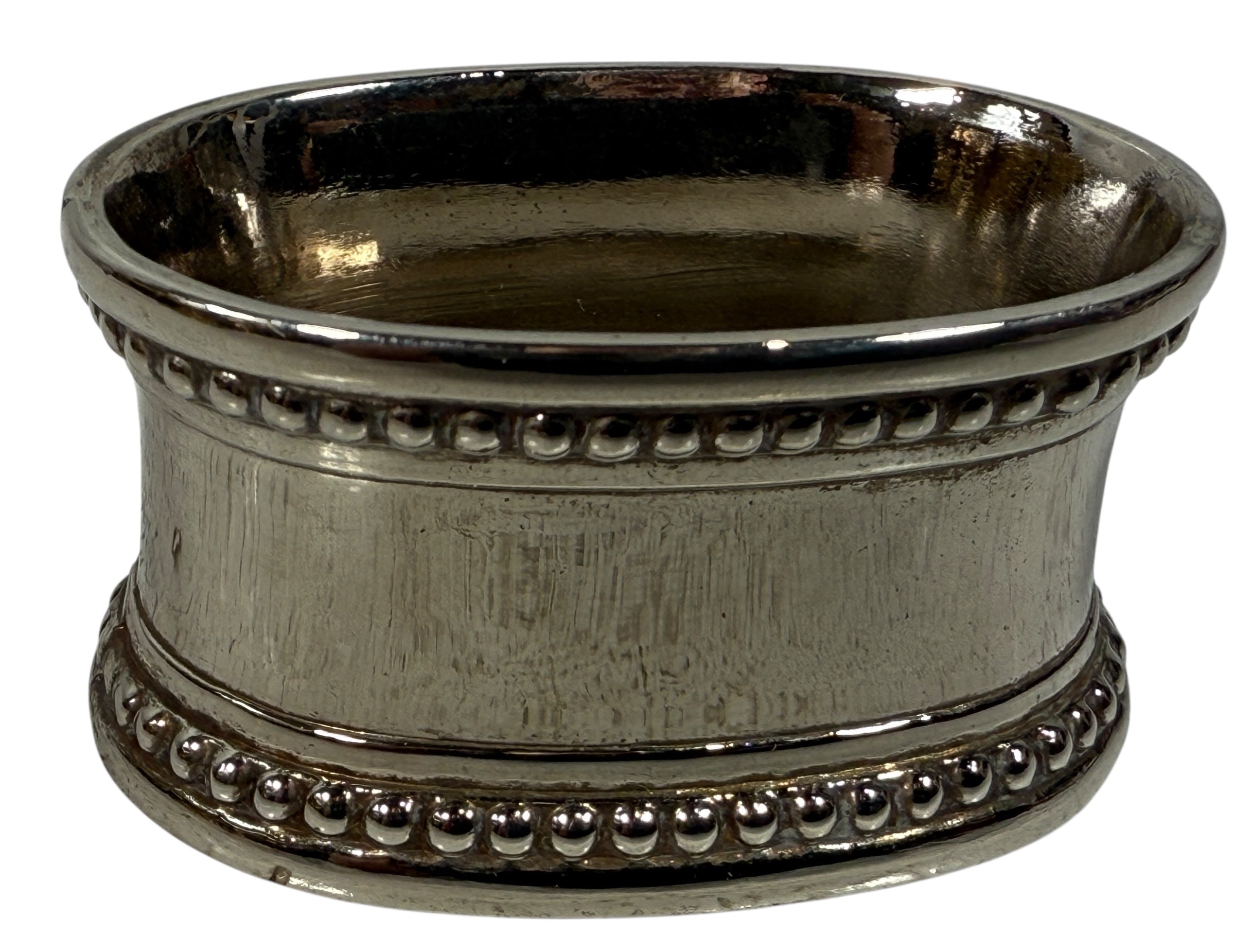 Set of 8 classic silverplate napkin rings with beaded edges. Unmonogrammed, polished, and in very good condition. Timeless tableware.