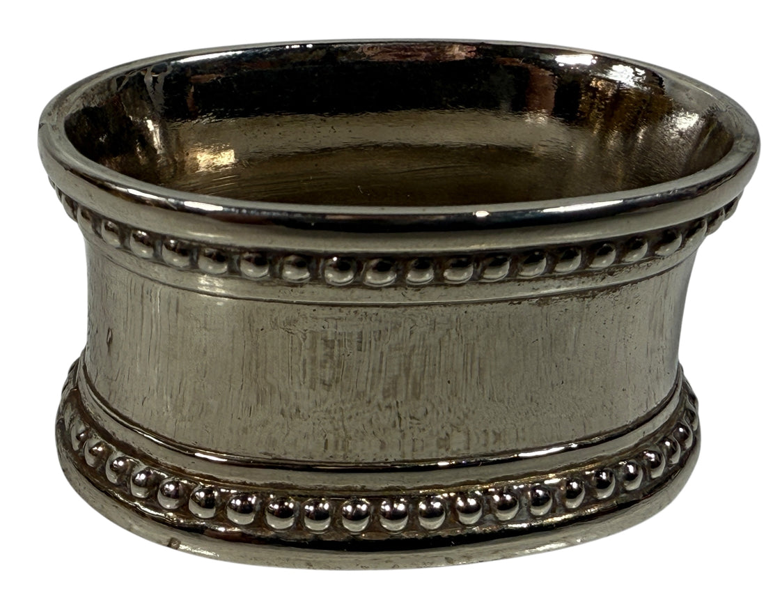 Set of 8 classic silverplate napkin rings with beaded edges. Unmonogrammed, polished, and in very good condition. Timeless tableware.