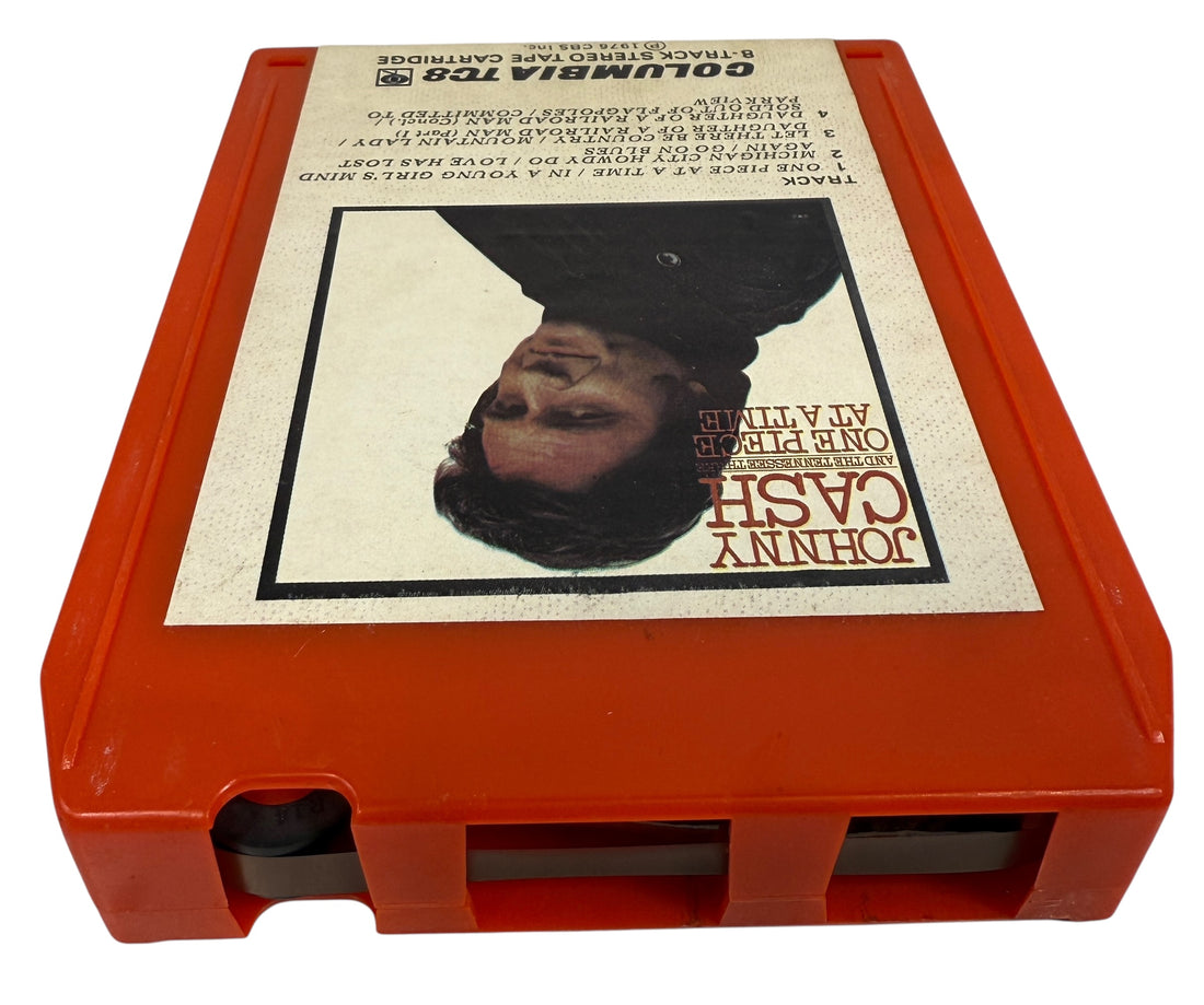 1976 Johnny Cash One Piece at a Time Columbia TC8 8-track tape. Red shell, clean label, collectible outlaw country format. Vintage audio for fans and collectors.