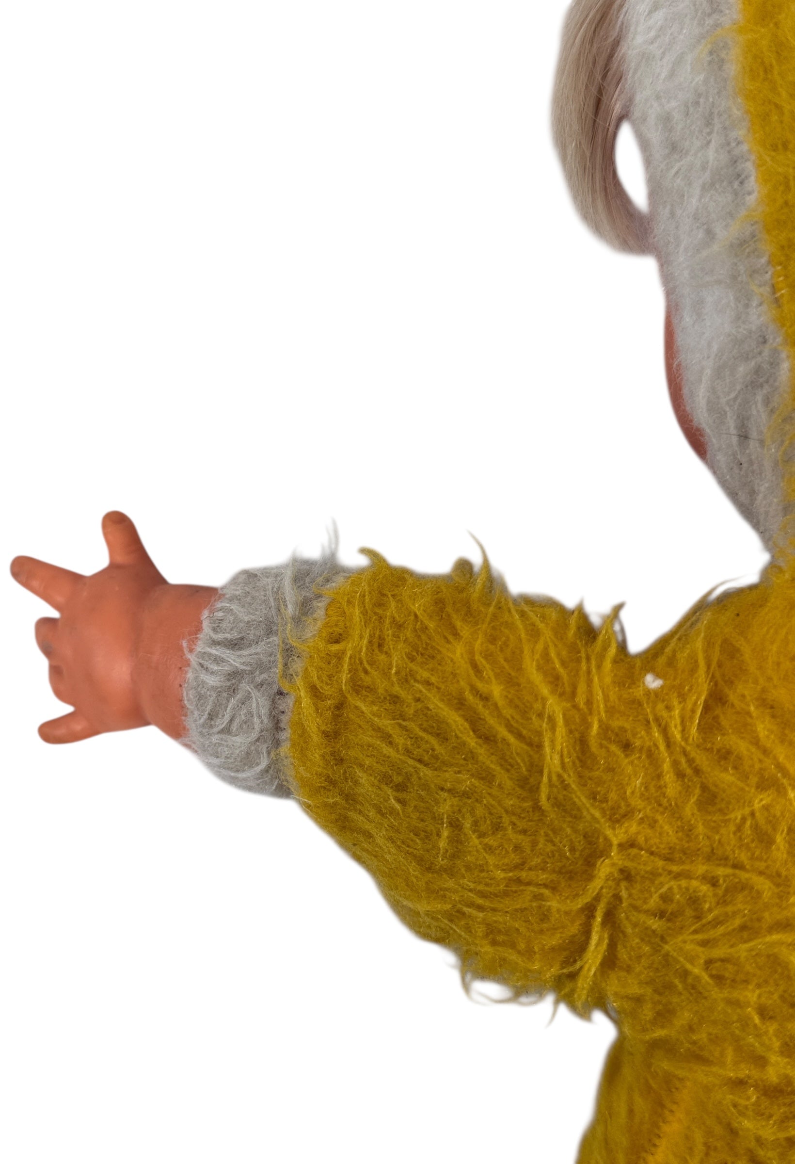 Vintage 1950s wind-up musical baby doll in yellow plush suit with vinyl face. Music plays well. Great display collectible. Ships from Canada.