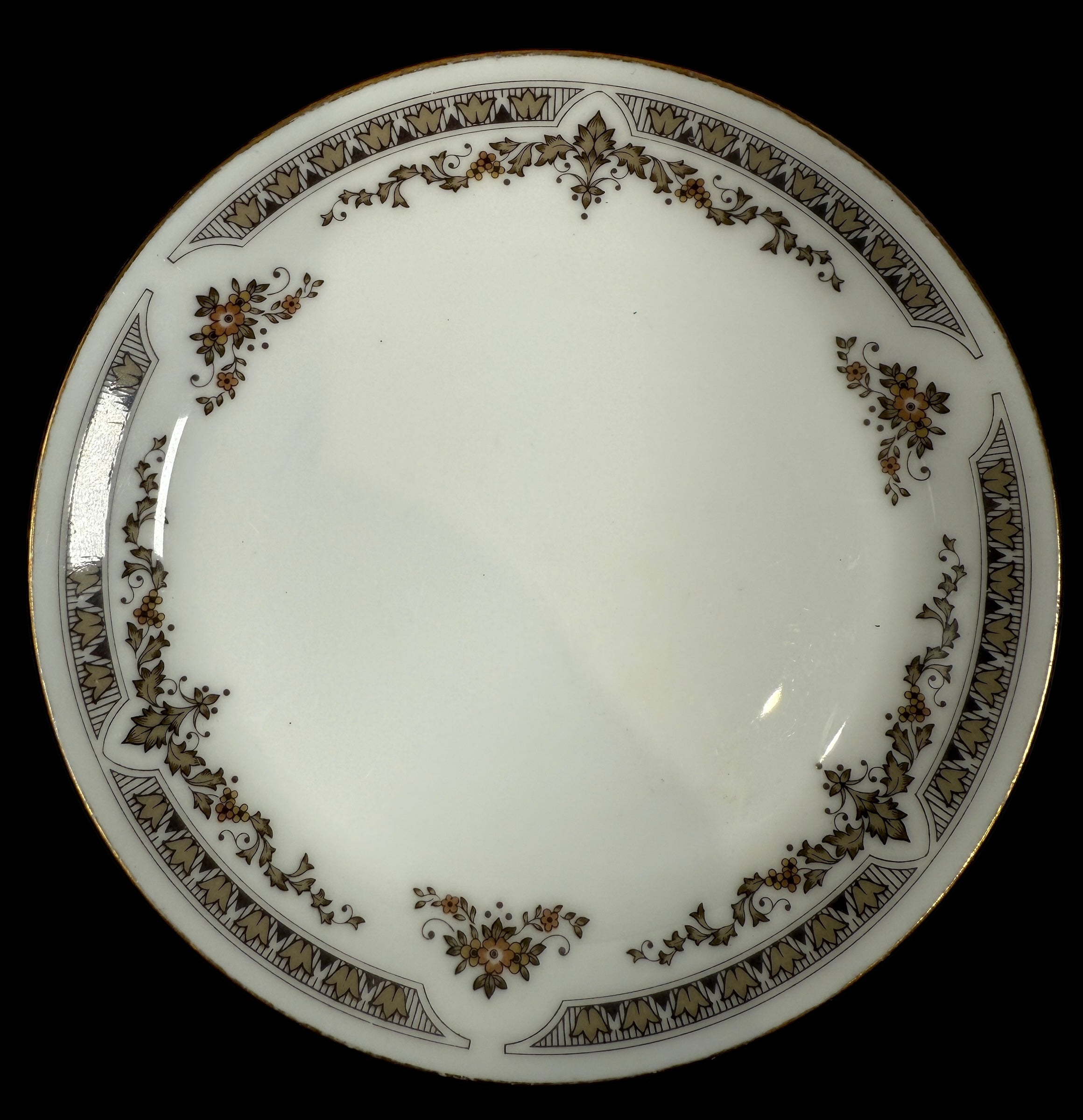 Decorative plate with brown floral patterns on a white background