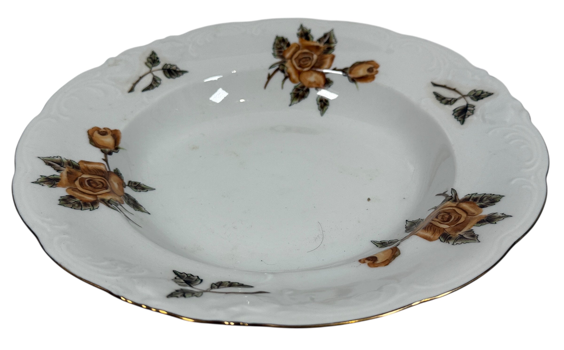 Ceramic plate with floral designs on a white background