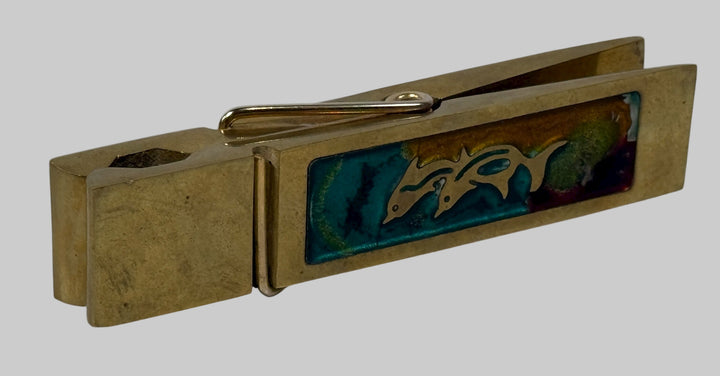 Vintage 1970s brass oversized clothespin clip with colorful enamel inset—5¾″ desk paperweight or décor accent. Mid-century modern charm.