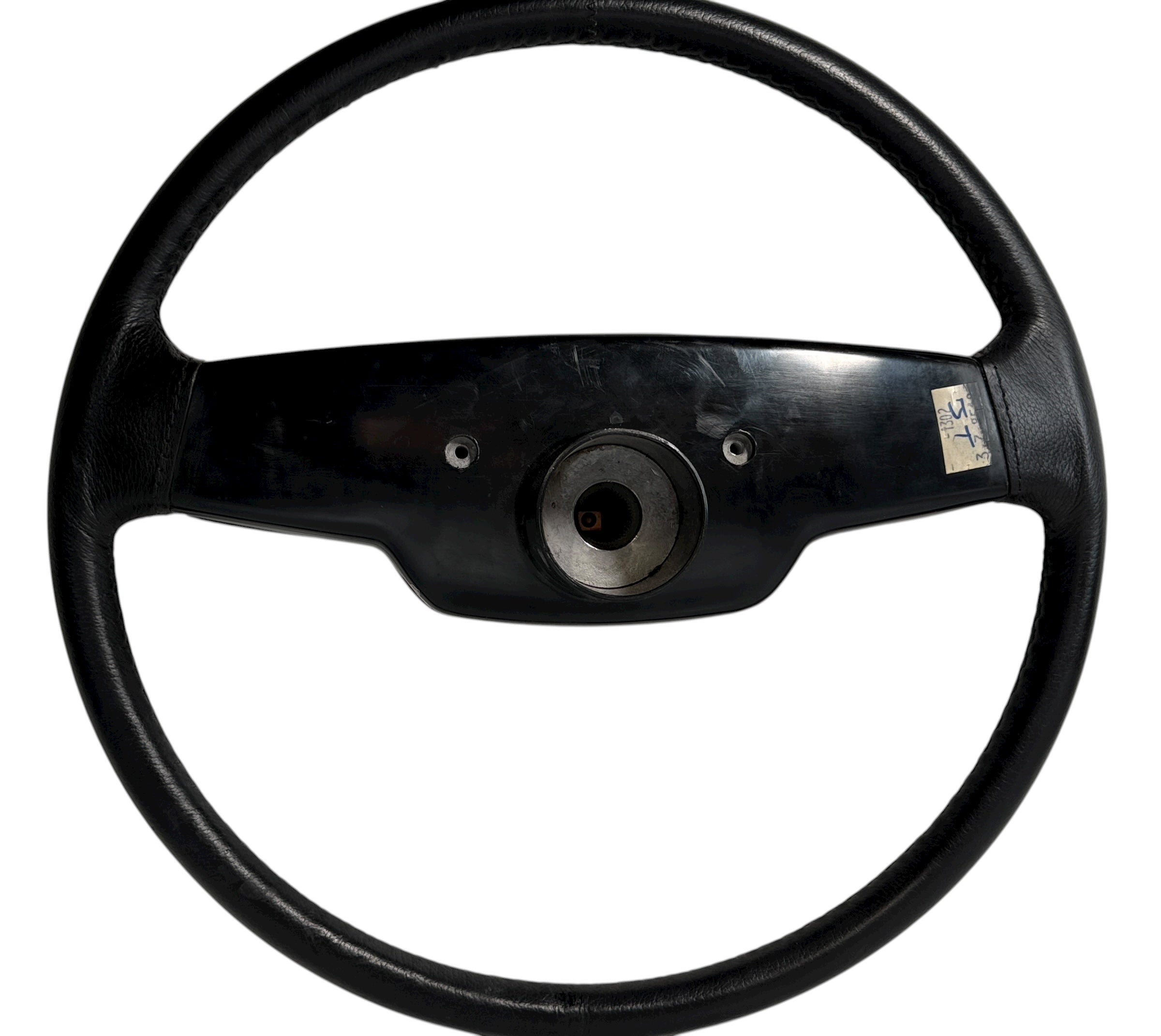 OEM Jaguar XJ6 Series III steering wheel with horn pad. Genuine 1980–87 UK-made replacement part in good driver condition. Vintage Jaguar interior collectible.