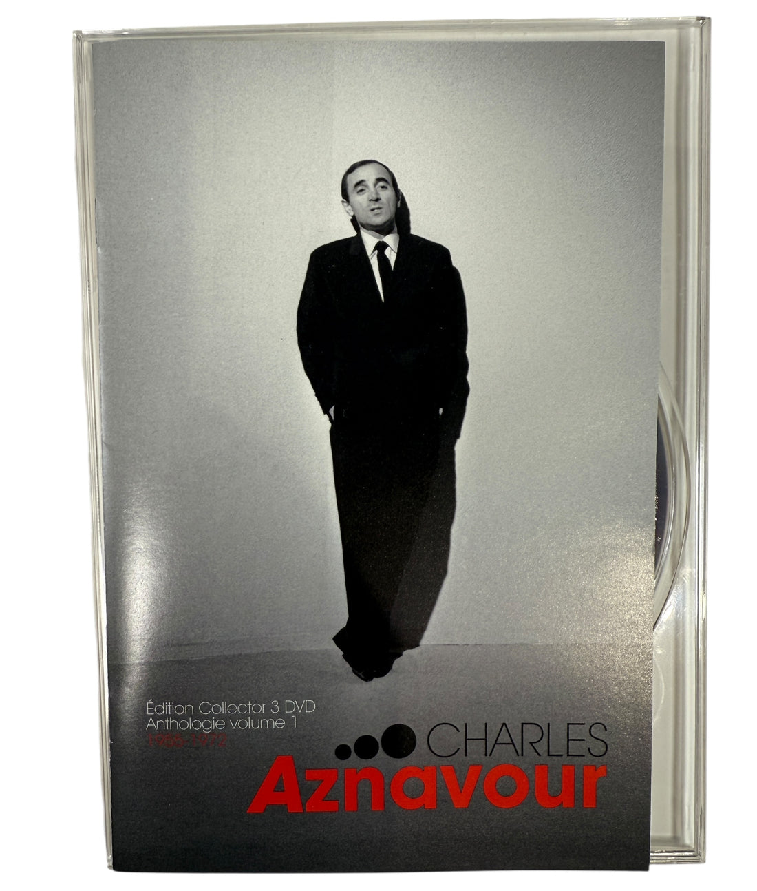 photo of a man in a suit and tie on the cover, featuring the name Charles Aznavour.