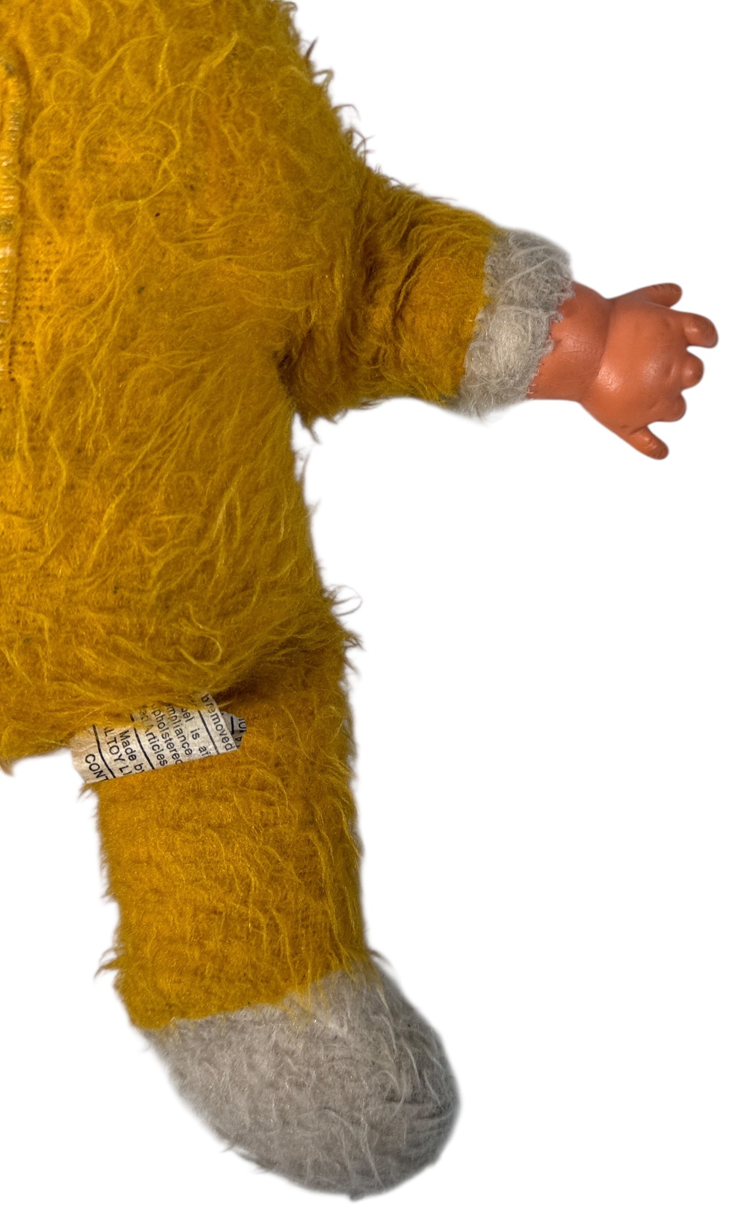 Vintage 1950s wind-up musical baby doll in yellow plush suit with vinyl face. Music plays well. Great display collectible. Ships from Canada.