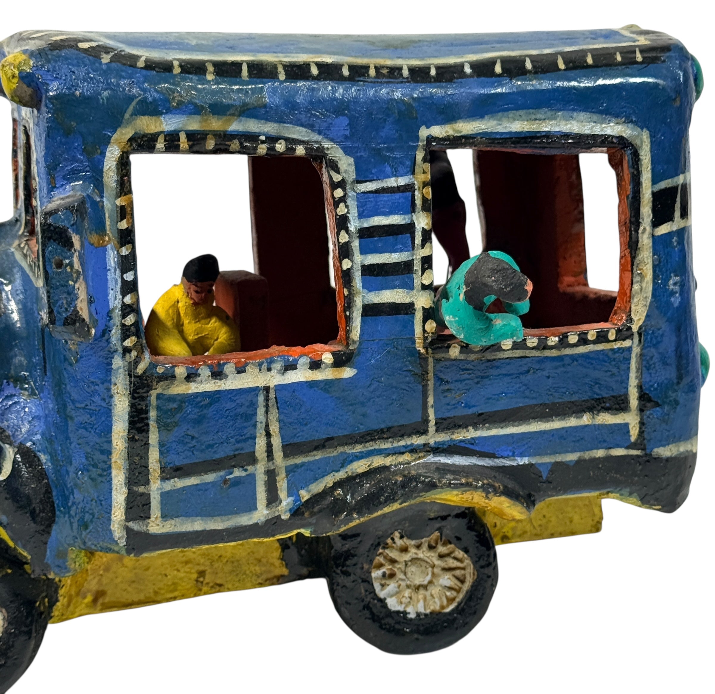 Vintage Mexican papier-mâché colectivo bus sculpture with hand-modeled interior figures. Folk art narrative piece with bold color and strong display presence.