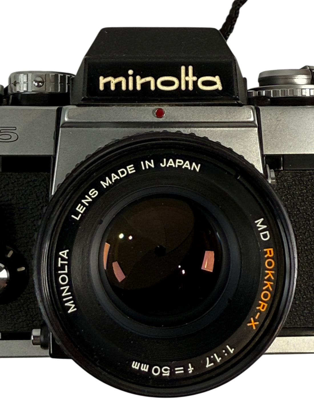Minolta camera with lens made in Japan on a white background