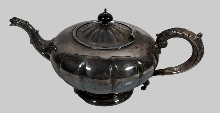 Decorative silver teapot on a white background