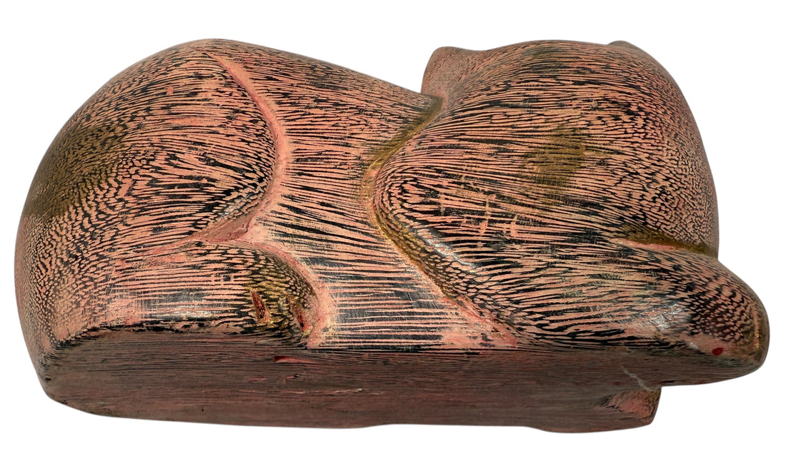 Hand-carved wooden cat sculpture in folk art style. Solid wood, decorative carved texture, warm natural finish. Unique décor piece for cat lovers.