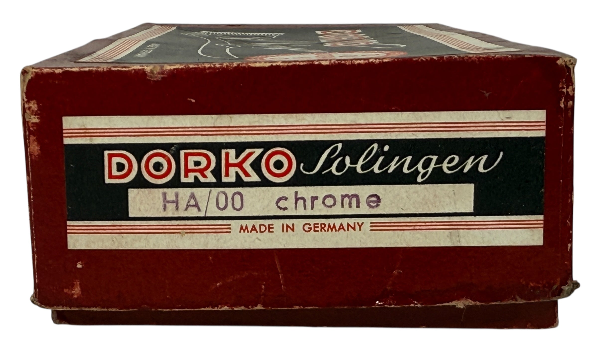 Vintage Dorko Solingen chrome #000 manual hair clipper with original box. German-made grooming tool for collectors, barbers, and vintage display.