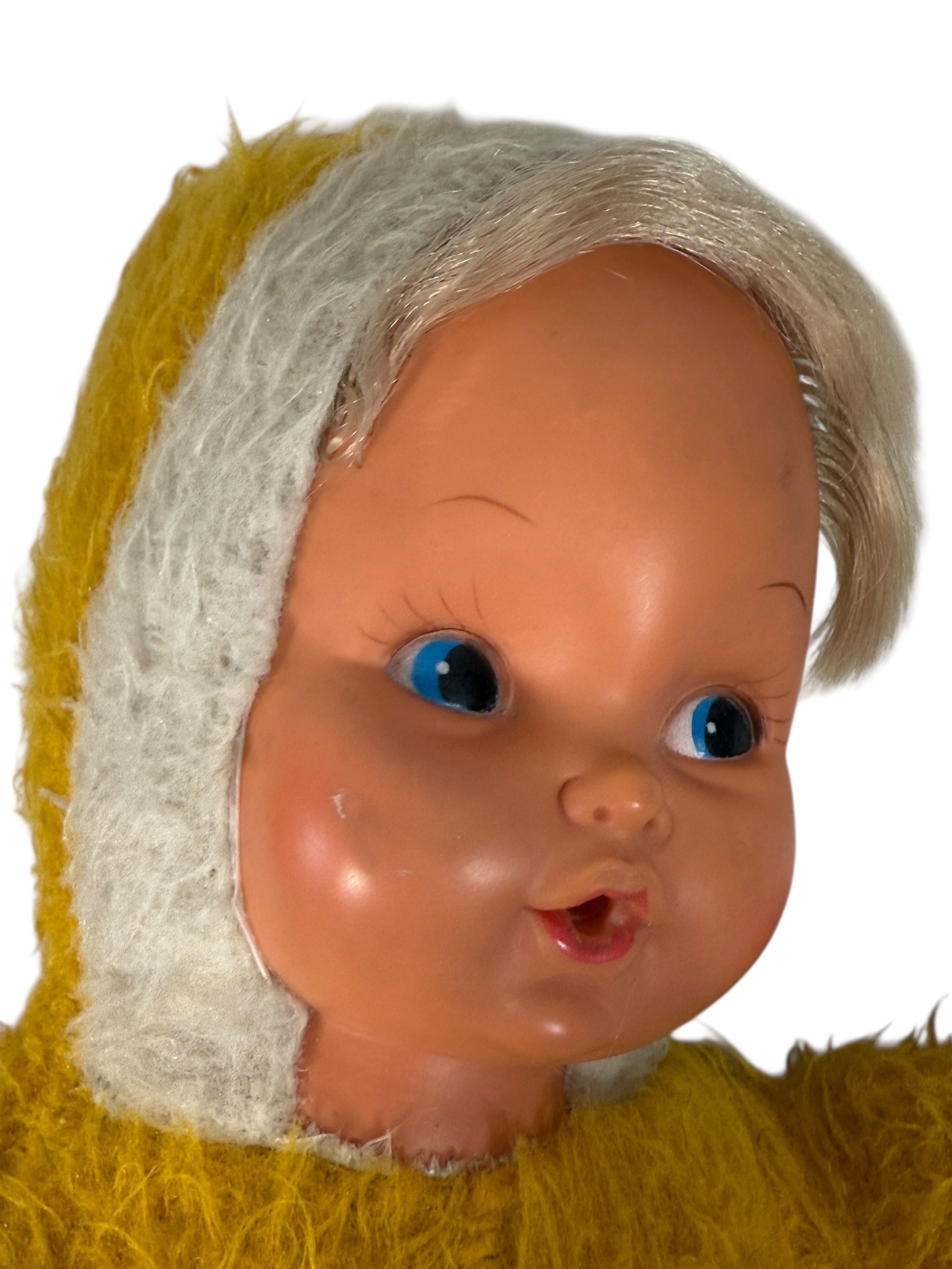 Vintage 1950s wind-up musical baby doll in yellow plush suit with vinyl face. Music plays well. Great display collectible. Ships from Canada.