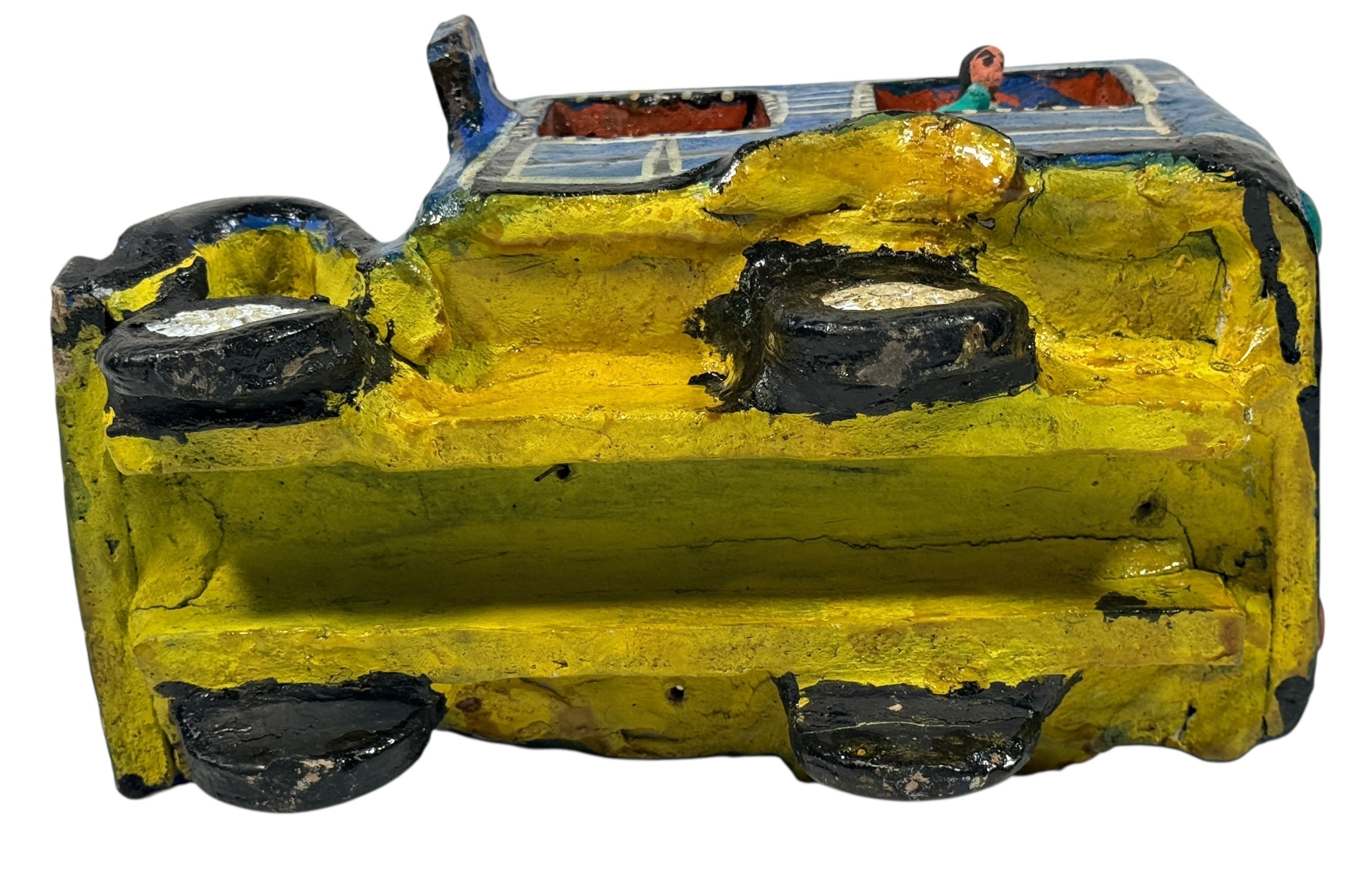 Vintage Mexican papier-mâché colectivo bus sculpture with hand-modeled interior figures. Folk art narrative piece with bold color and strong display presence.
