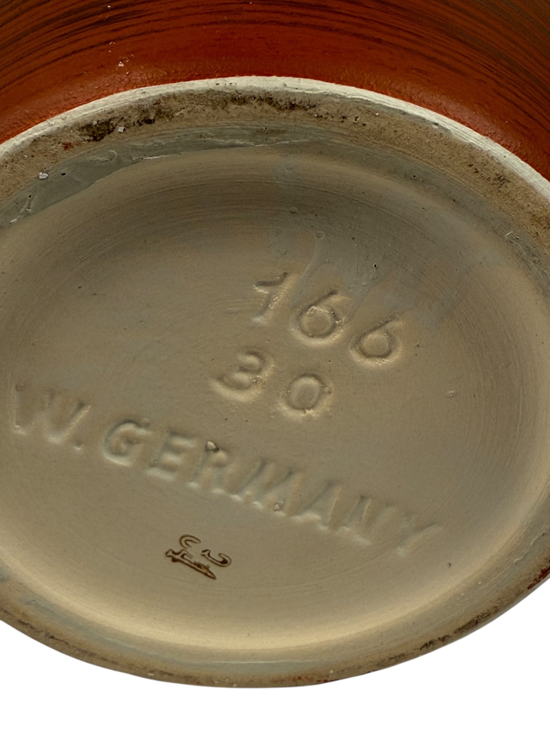 Stoneware plate with '1668' and 'W. Germany' branding on a white background