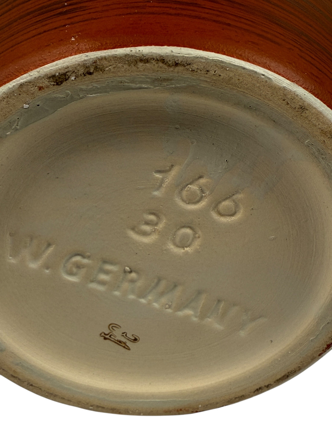 Stoneware plate with '1668' and 'W. Germany' branding on a white background
