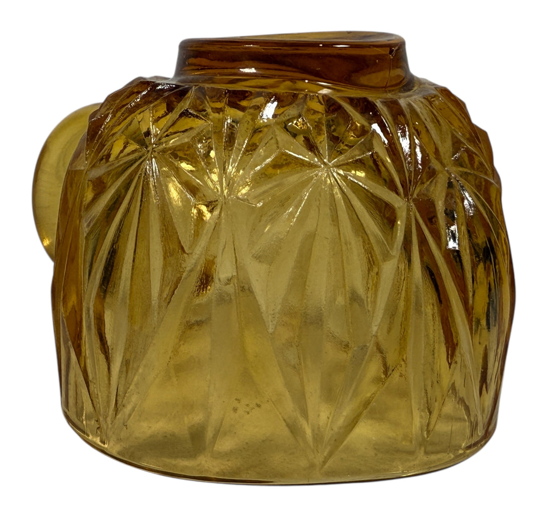 Vintage mid-century amber glass punch bowl set with cups and ladle. Classic starburst pattern, complete set, perfect for retro entertaining.