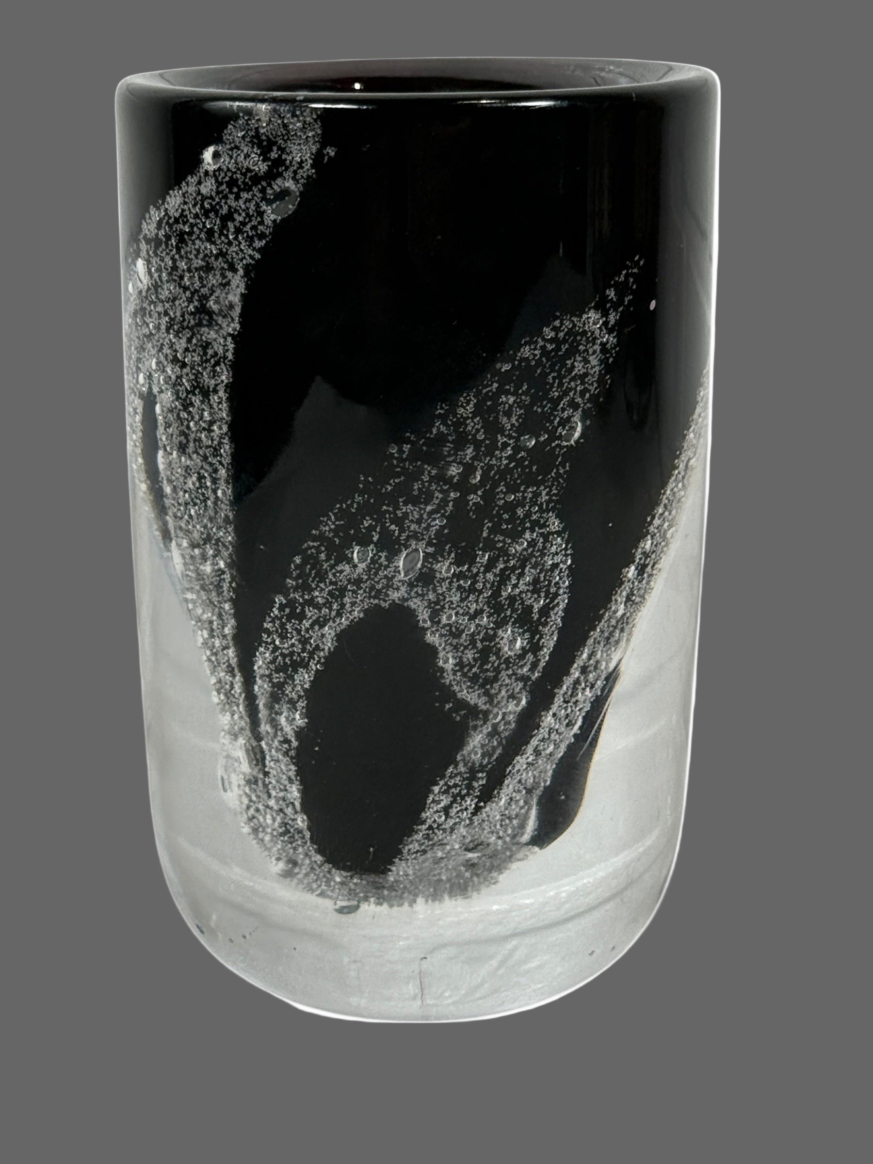 Kosta , Sweden Vase .Black and clear glass vase with abstract design on a white background