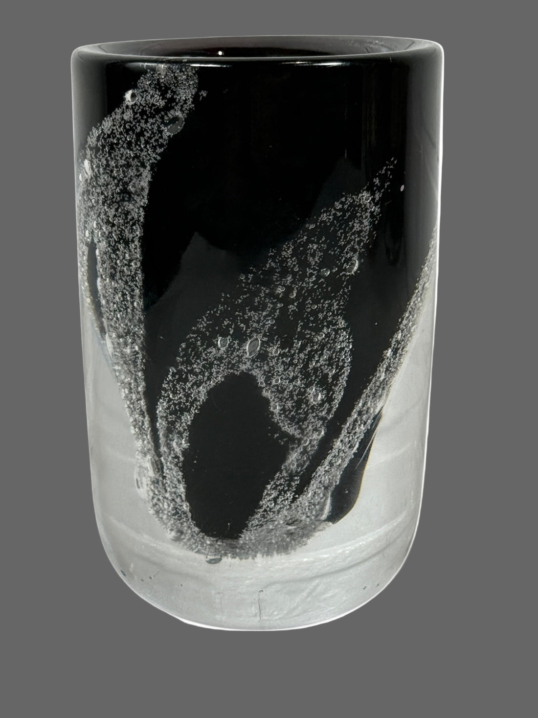 Kosta , Sweden Vase .Black and clear glass vase with abstract design on a white background