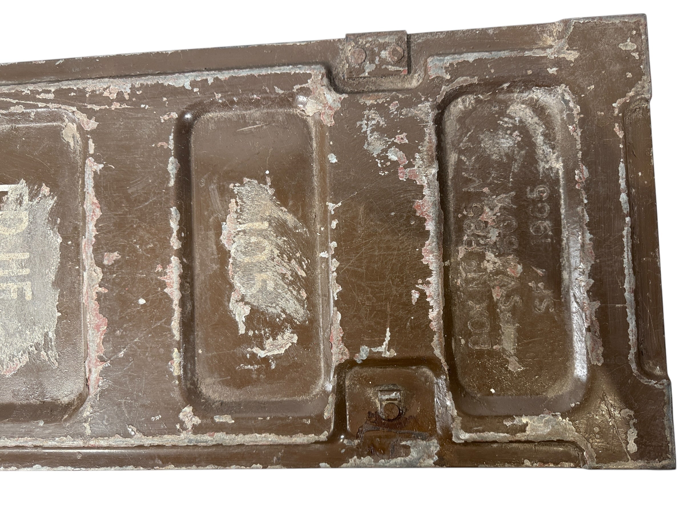 Vintage chocolate mold with multiple compartments on a white background