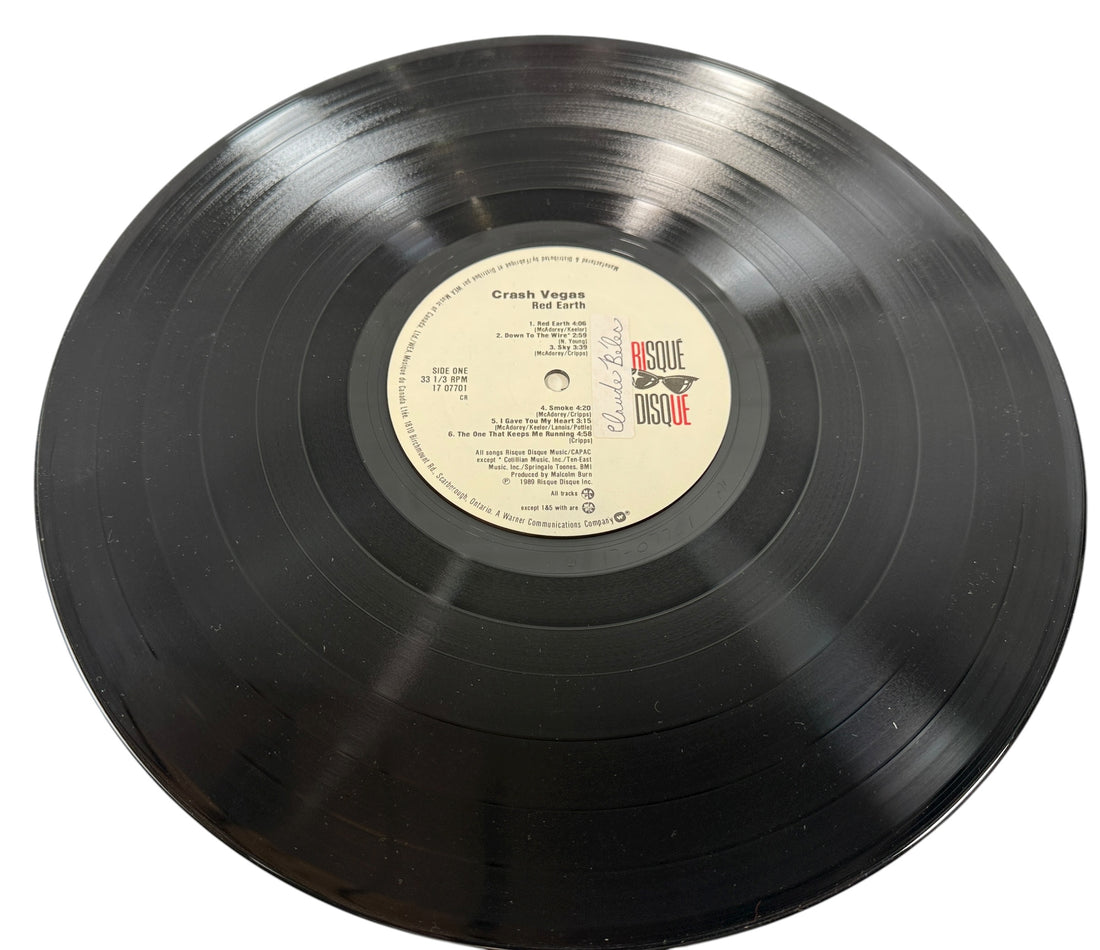 1989 Canadian LP Red Earth by Crash Vegas on Risqué Disque/WEA. VG+ vinyl, lyric sleeve included. Rare folk-rock pressing from late-’80s Canada.