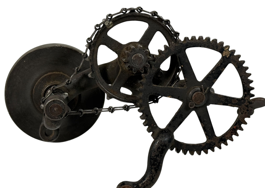 Working antique clamp-on cast-iron grinder with chain drive. Compact 19th-century sharpening tool, fully functional. Industrial décor or collector piece.