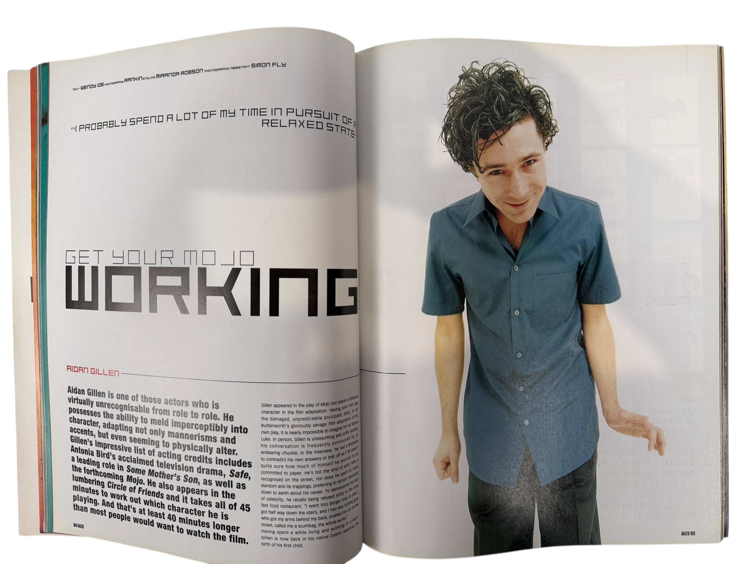 Open magazine with a person on the right and text on the left