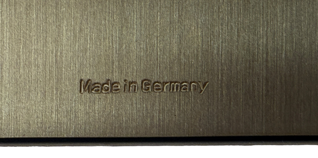 Text 'Made in Germany' embossed on a metallic surface