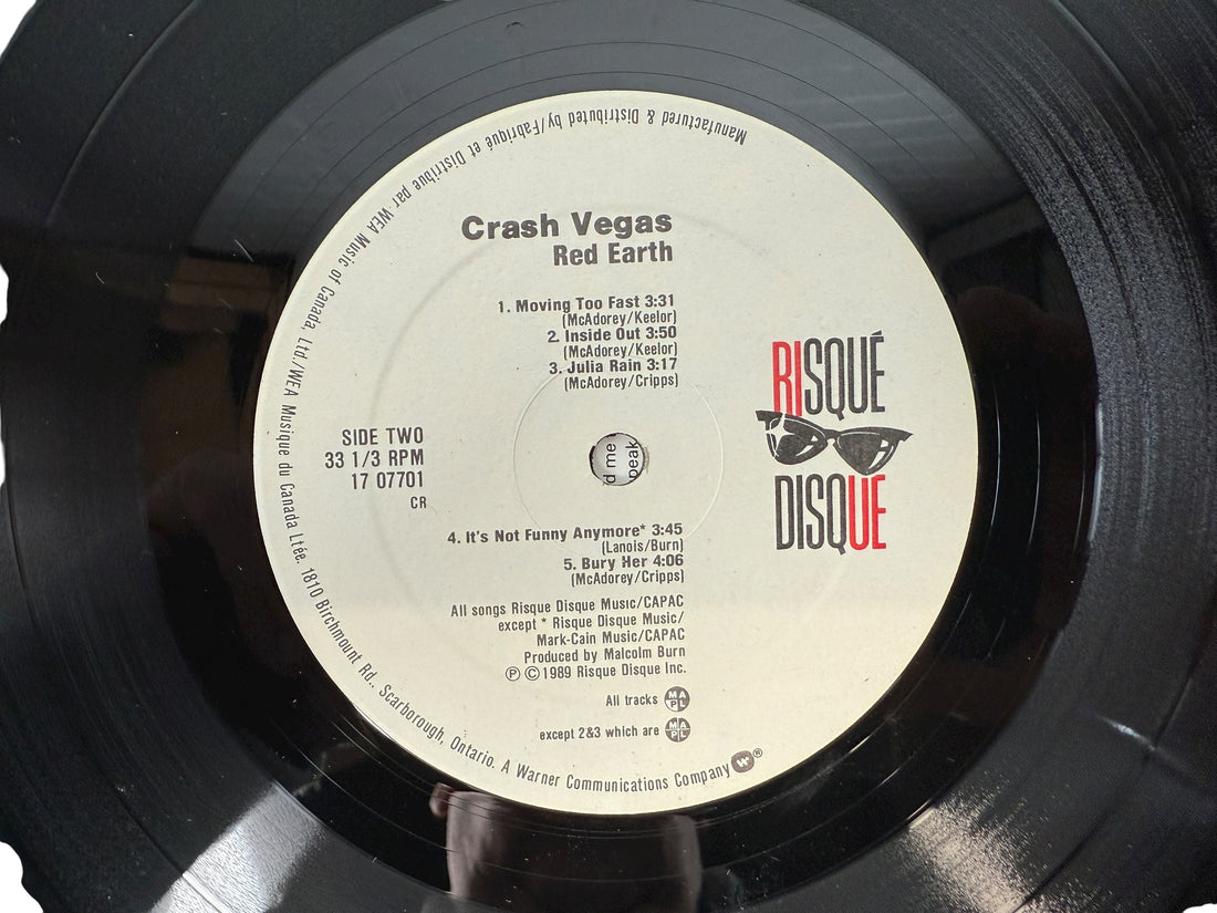 1989 Canadian LP Red Earth by Crash Vegas on Risqué Disque/WEA. VG+ vinyl, lyric sleeve included. Rare folk-rock pressing from late-’80s Canada.