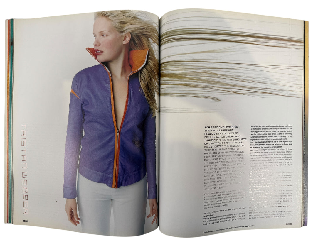 Open magazine showing a person wearing a purple jacket with orange accents
