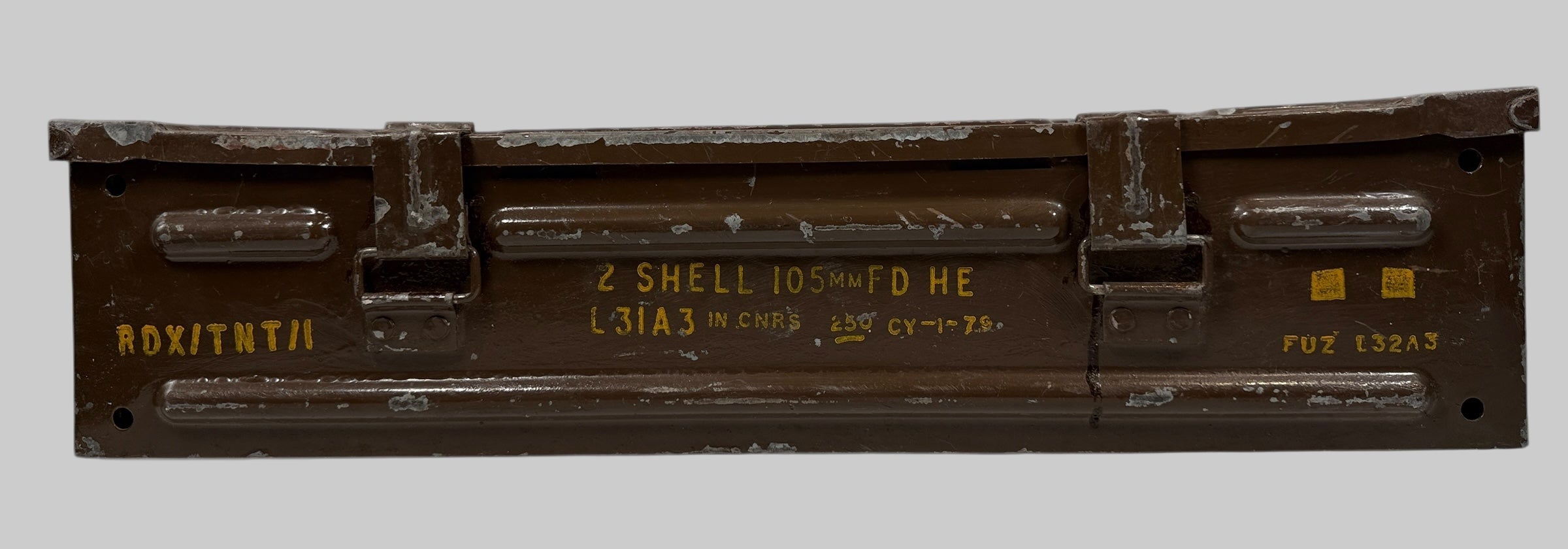 Metallic box with text and markings on a gray background