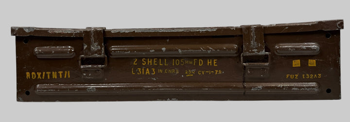 Metallic box with text and markings on a gray background