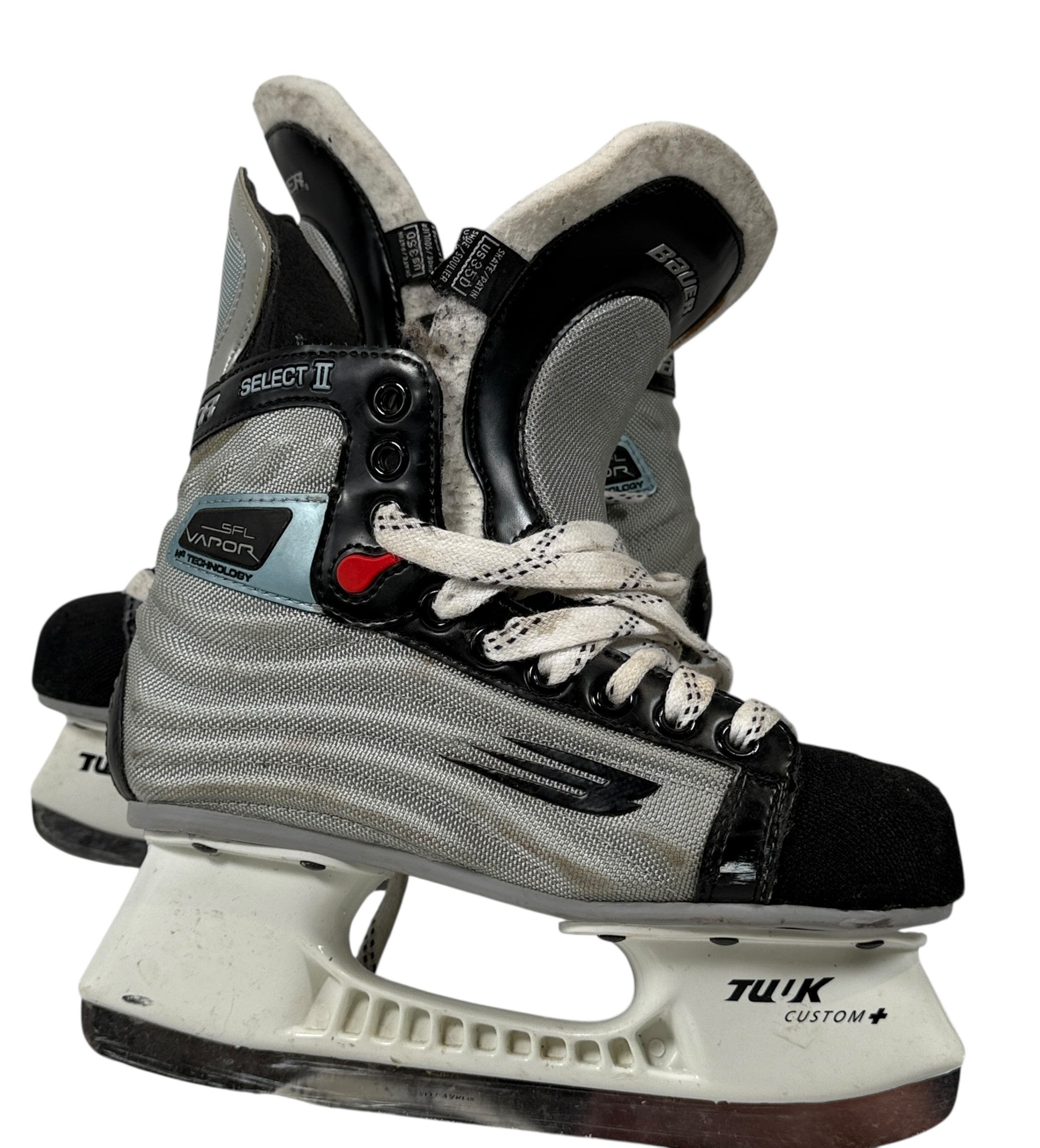 Pair of ice hockey skates with visible branding on a white background