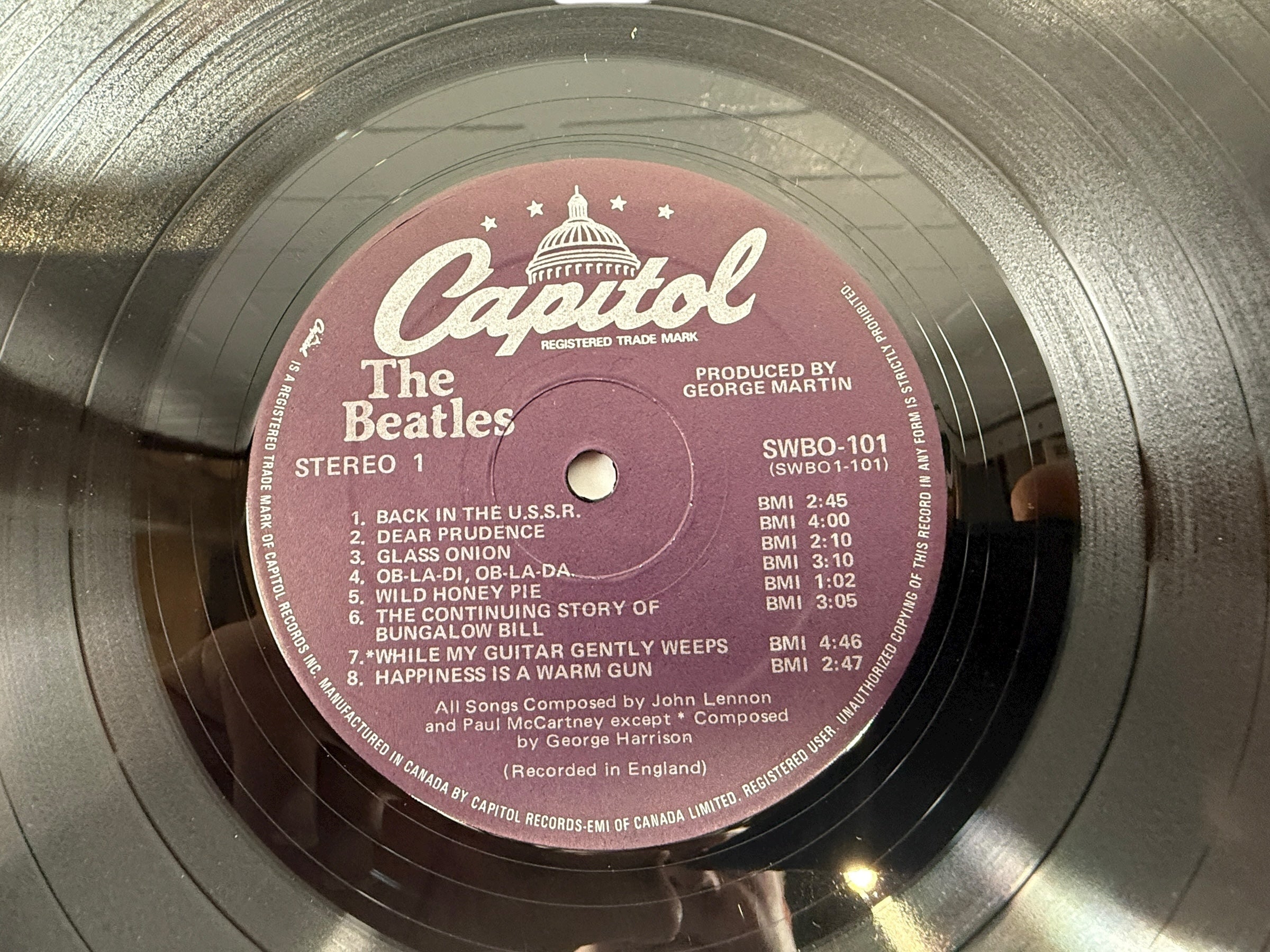 Complete Canadian pressing of The Beatles White Album with poster and all four photos. Classic SWBO-101 2LP set for collectors and vinyl fans.