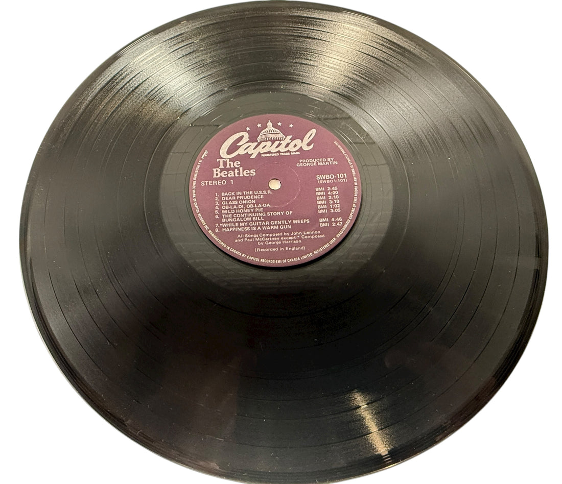Complete Canadian pressing of The Beatles White Album with poster and all four photos. Classic SWBO-101 2LP set for collectors and vinyl fans.
