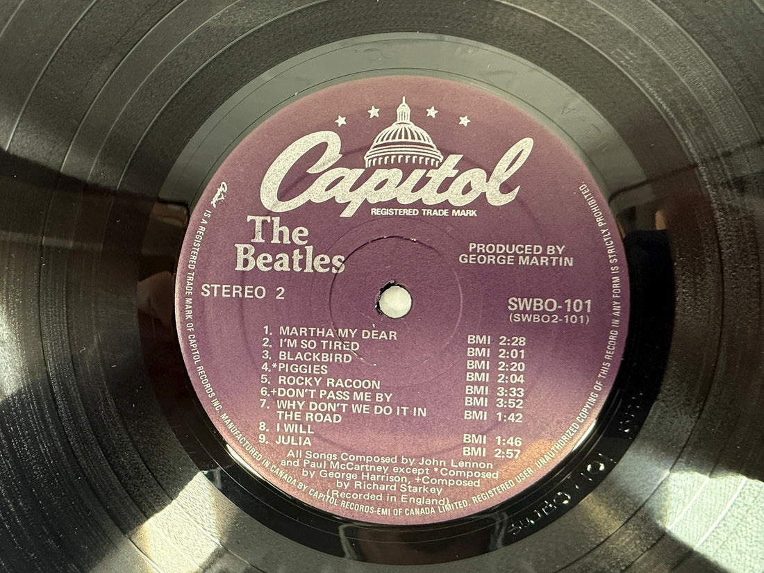 Complete Canadian pressing of The Beatles White Album with poster and all four photos. Classic SWBO-101 2LP set for collectors and vinyl fans.