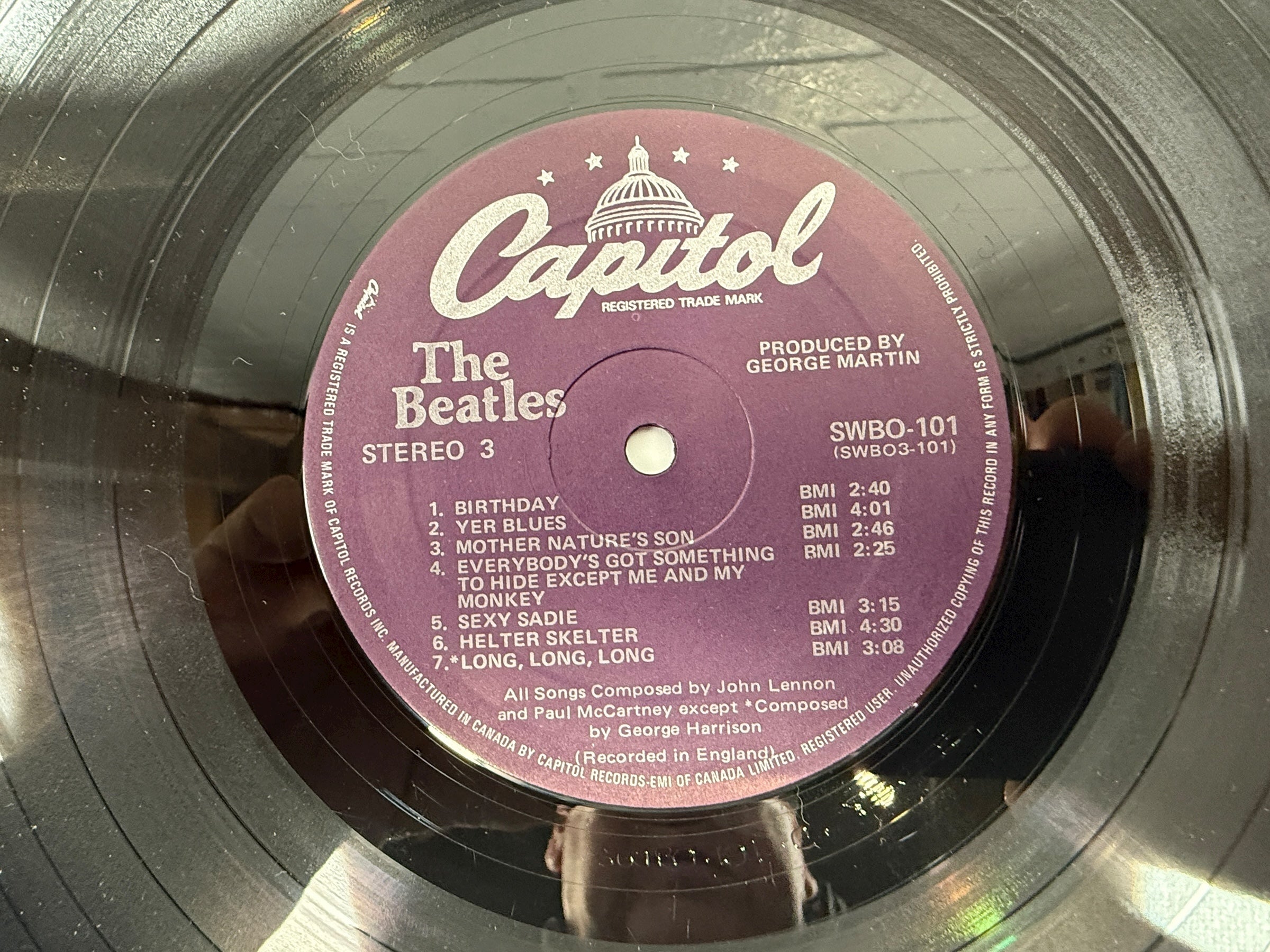 Complete Canadian pressing of The Beatles White Album with poster and all four photos. Classic SWBO-101 2LP set for collectors and vinyl fans.