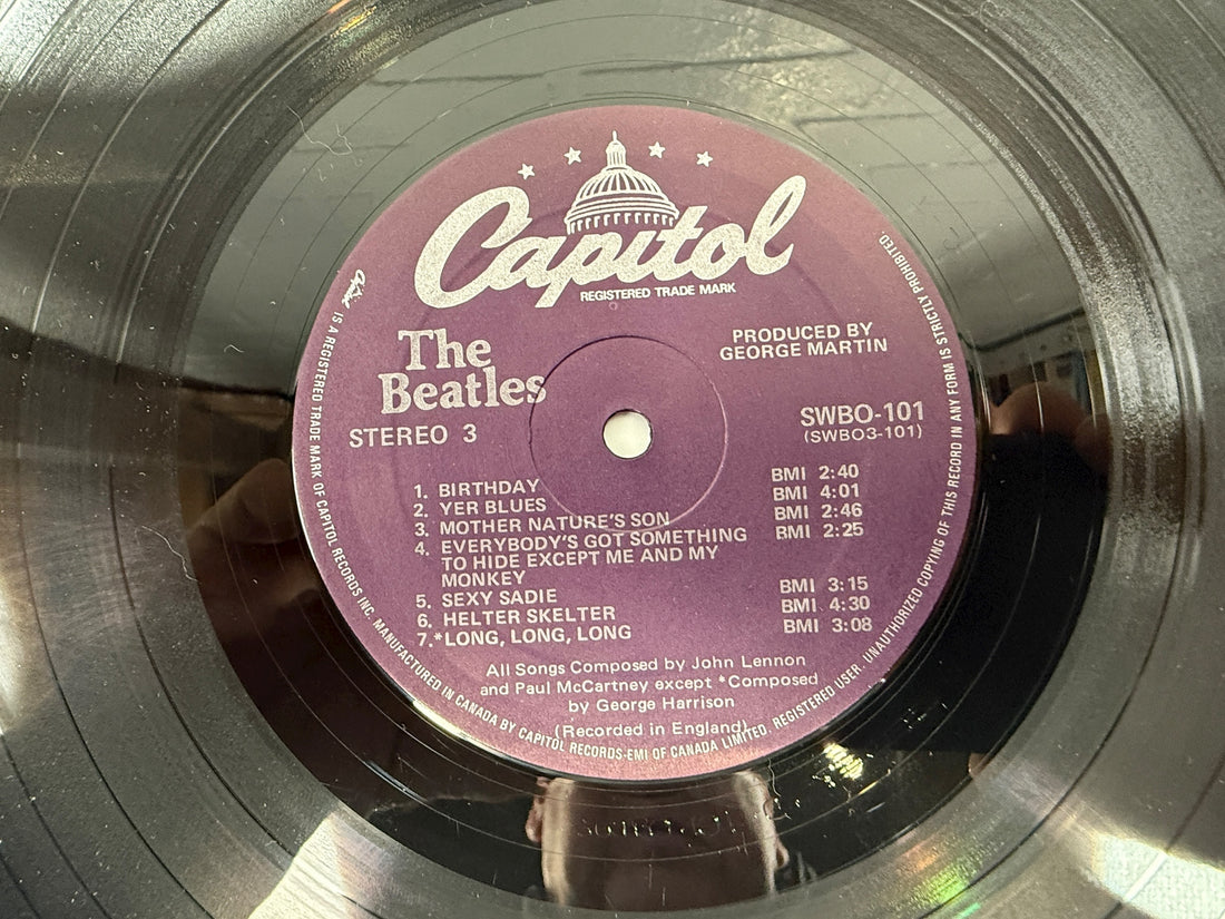 Complete Canadian pressing of The Beatles White Album with poster and all four photos. Classic SWBO-101 2LP set for collectors and vinyl fans.