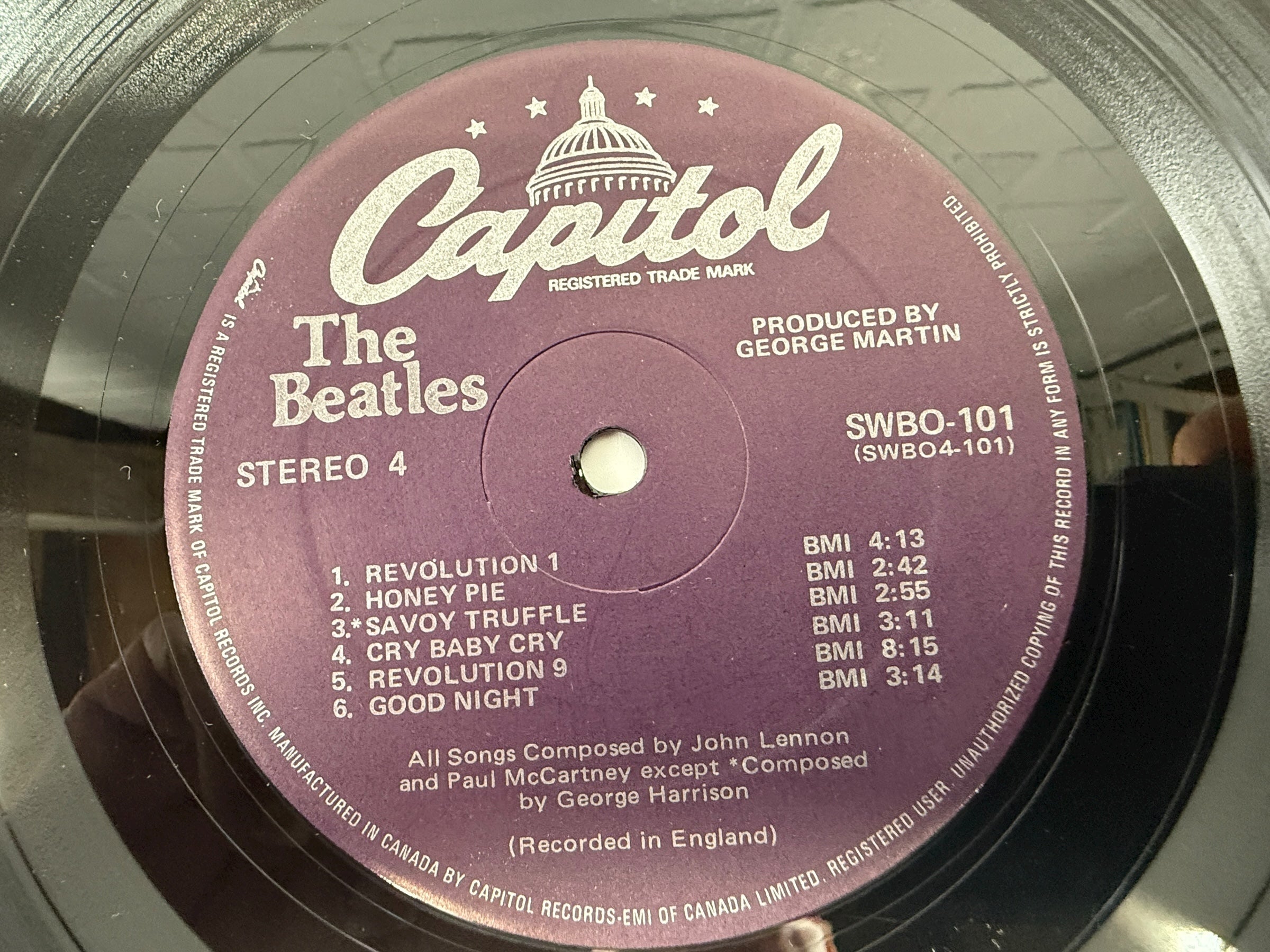 Complete Canadian pressing of The Beatles White Album with poster and all four photos. Classic SWBO-101 2LP set for collectors and vinyl fans.