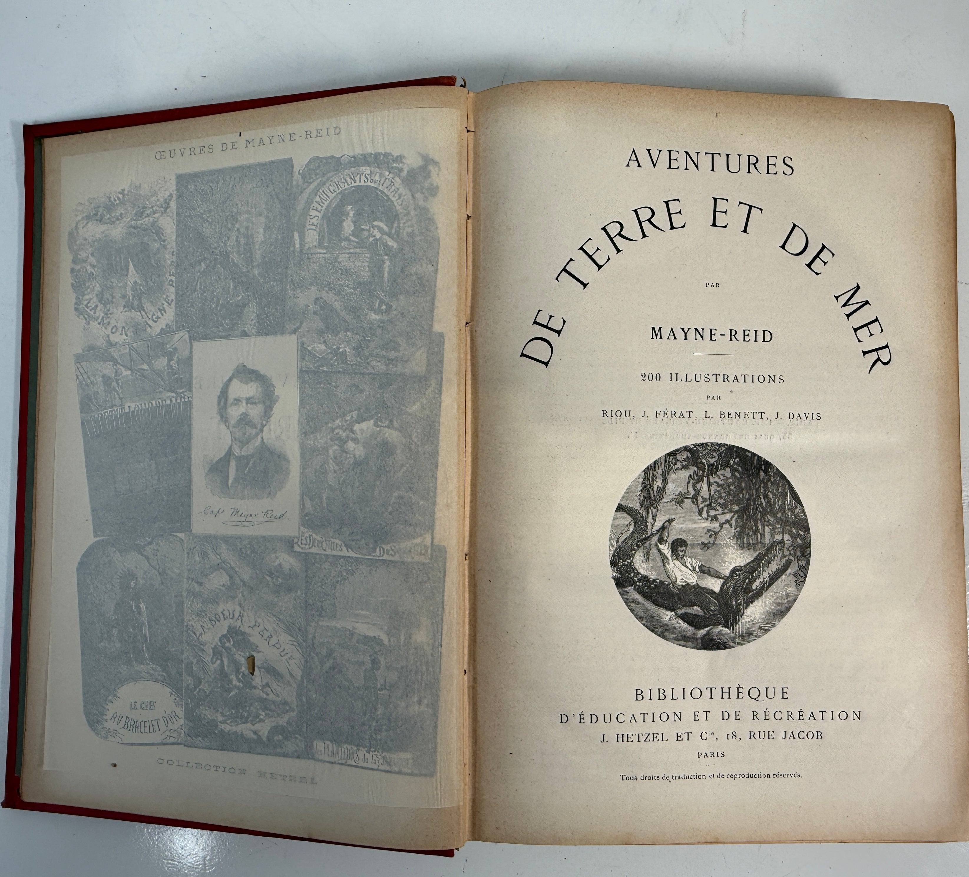 Open book titled 'Aventures de Terre et de Mer' with illustrations on a white background