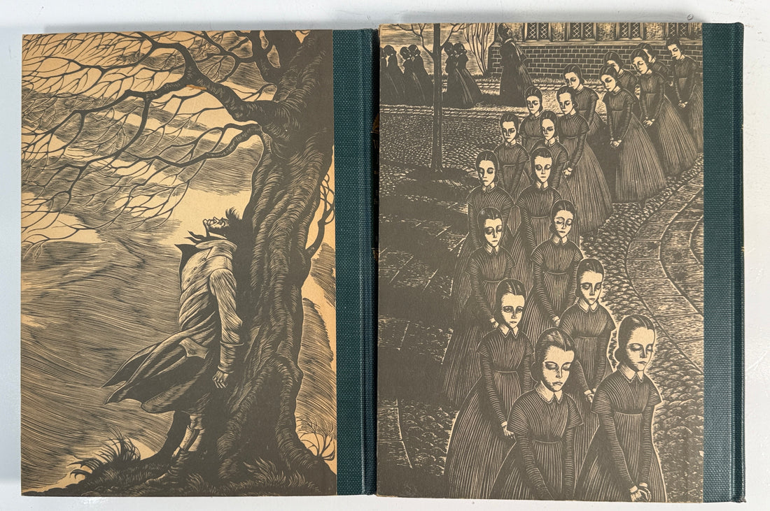 Book with engraved illustrations on the cover, featuring a figure by a tree and a group of people.