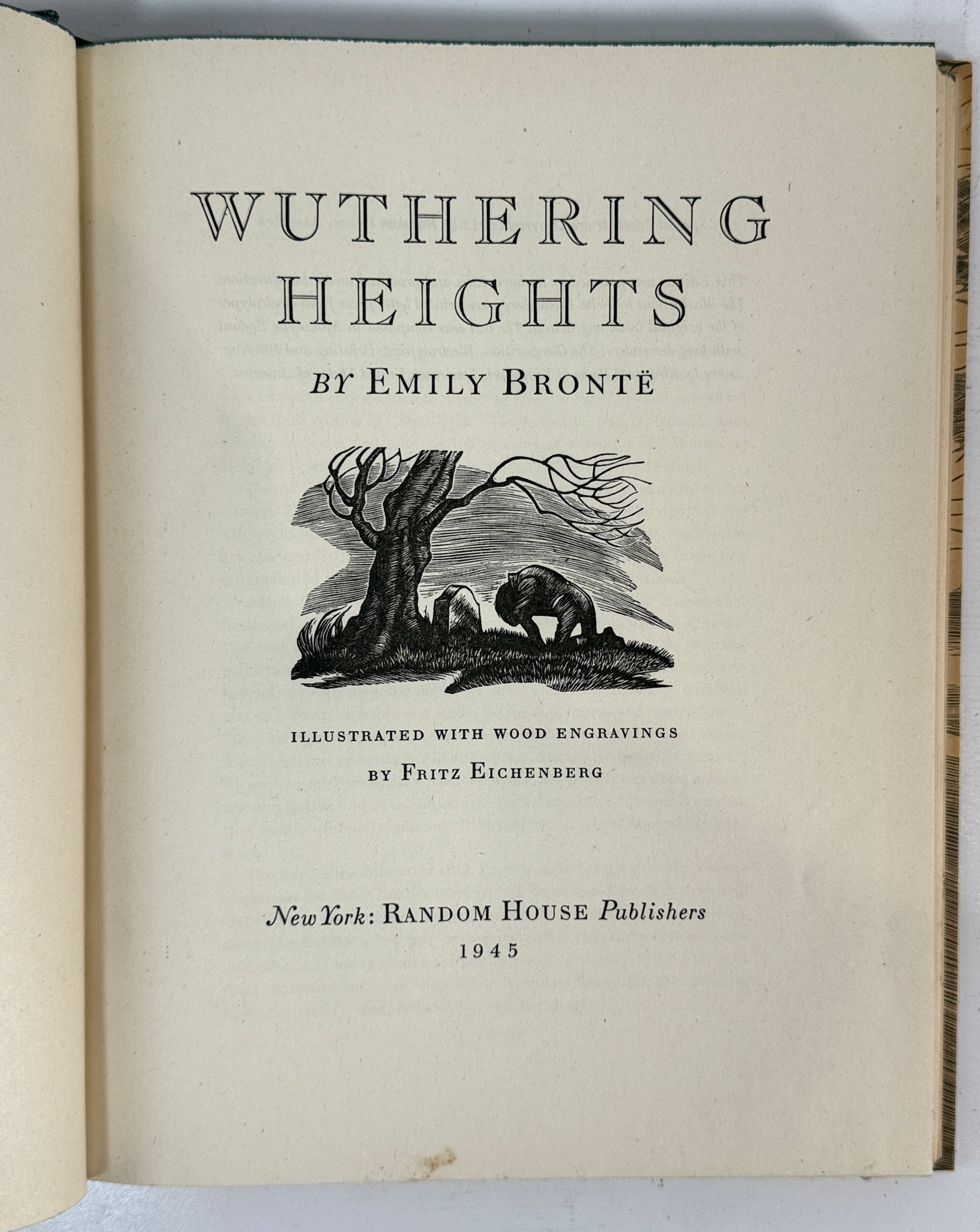 Title page of 'Wuthering Heights' by Emily Bronte with wood engravings on a white background.