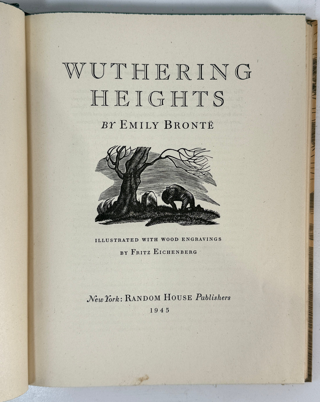 Title page of 'Wuthering Heights' by Emily Bronte with wood engravings on a white background.