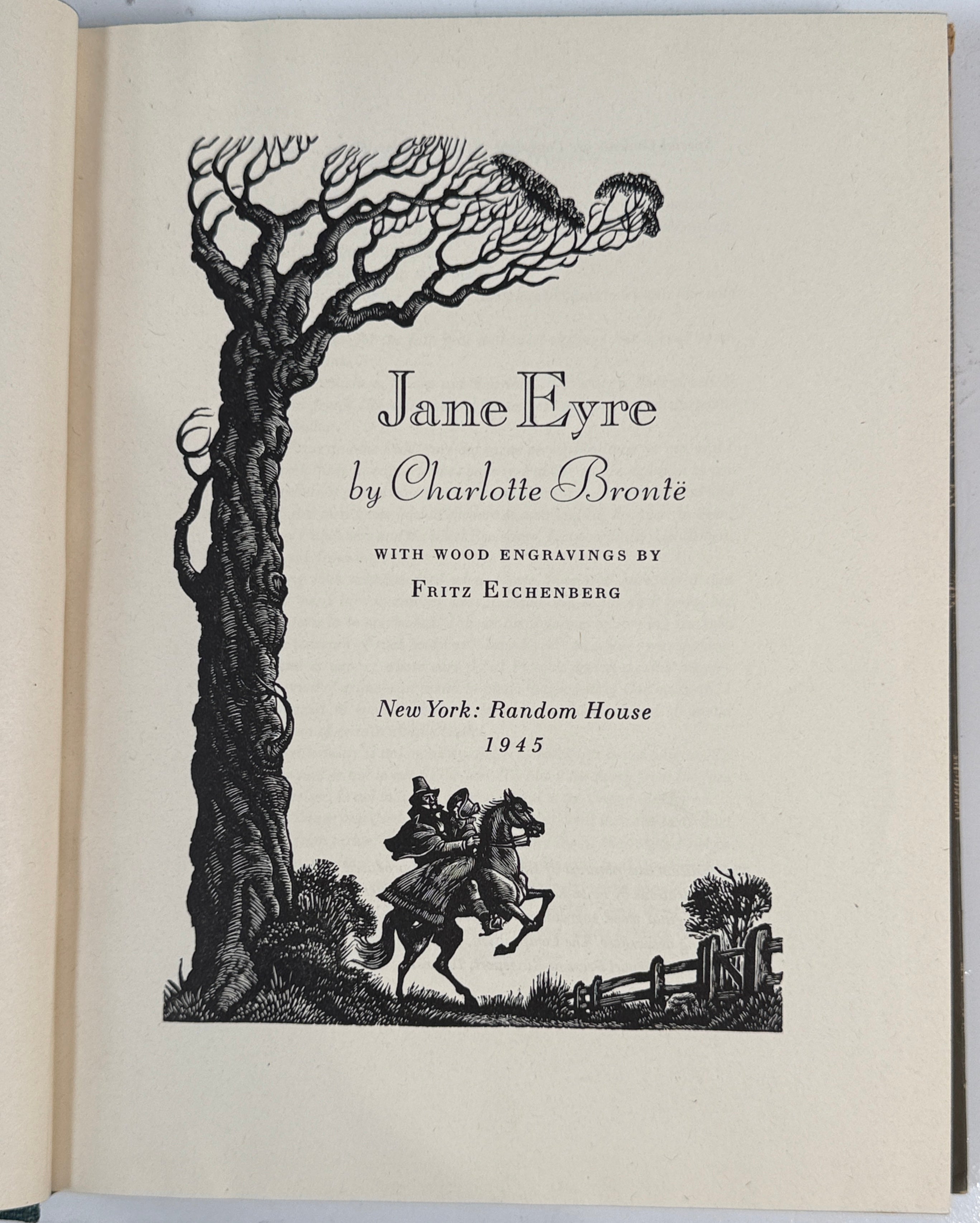 Title page of 'Jane Eyre' by Charlotte Bronte with wood engravings on a beige background